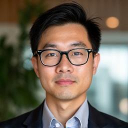 Headshot of James Chen, a calm, insightful looking man with short hair and glasses.