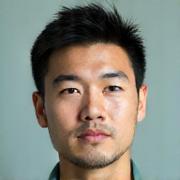 Portrait of James Chen, a calm and insightful man with a relaxed yet professional presence.