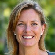 Portrait of Lisa Thompson, an energetic and approachable woman with an infectious enthusiasm for sustainable living.