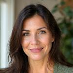 Portrait of Jennifer, glowing with a sense of purpose and healthier living, perhaps with some subtle greenery in the background.